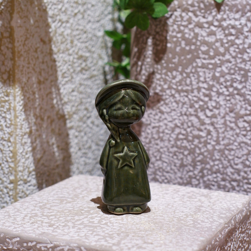 Olive-green Vietnamese ceramic star child figurine