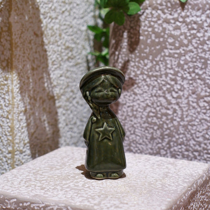 Olive-green Vietnamese ceramic star child figurine