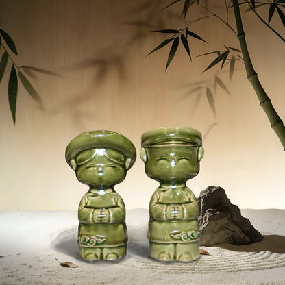 Green-glazed Vietnamese ao dai children couple figurines in a zen garden setting