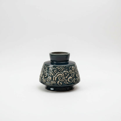 A deep blue Vietnamese ceramic vase with a unique cloud motif. This stunning ash glaze vase.