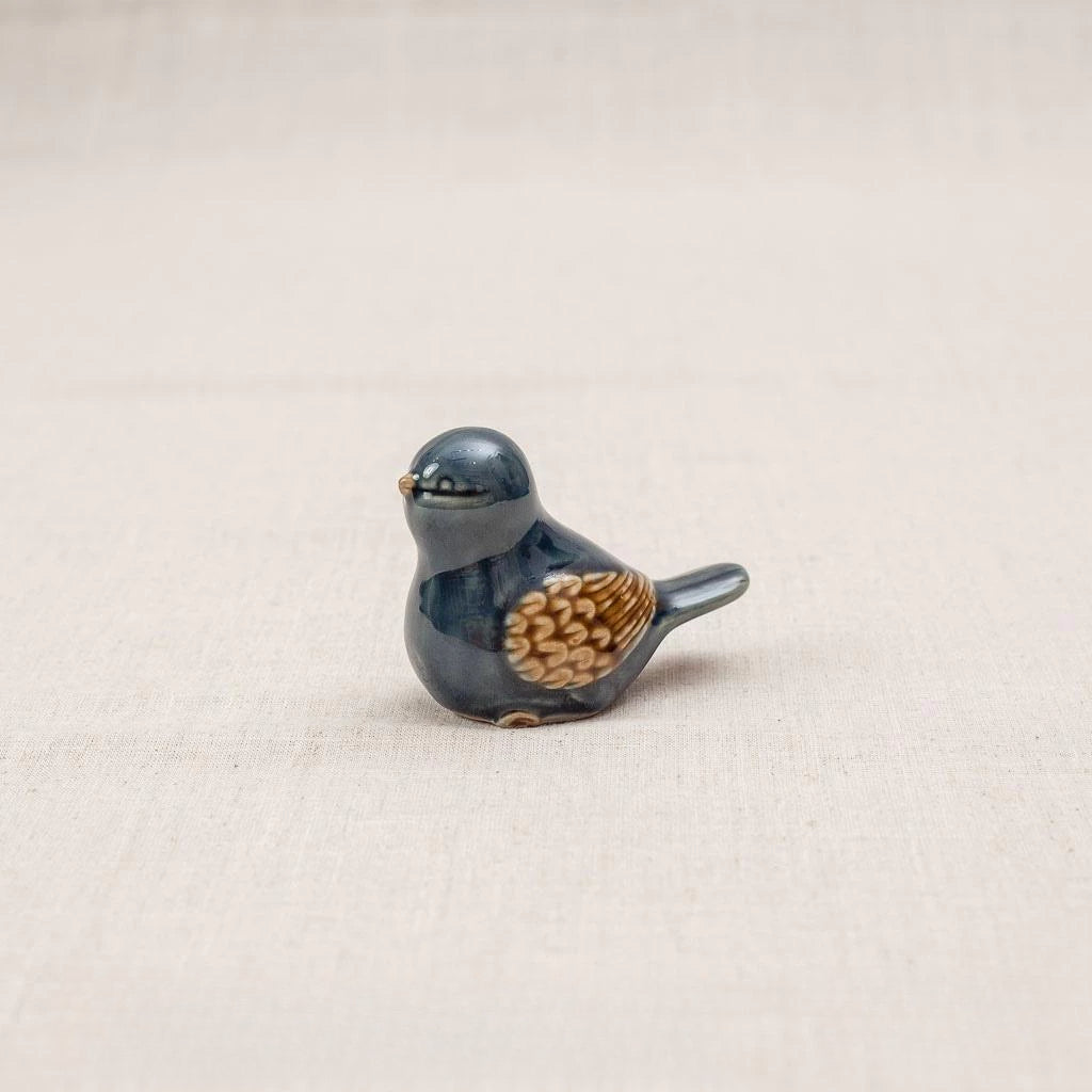 Close-up of a blue-glazed Vietnamese ceramic bird figurine