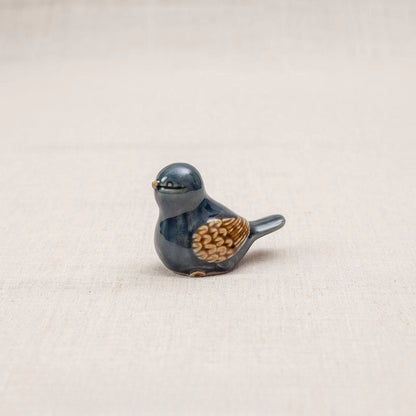 Close-up of a blue-glazed Vietnamese ceramic bird figurine