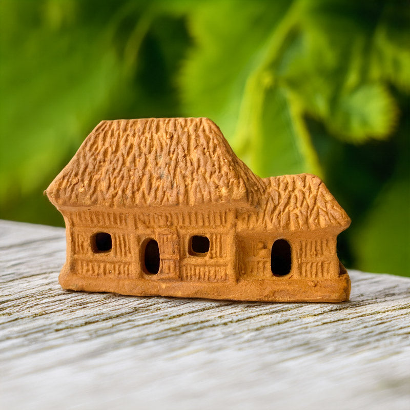 Miniature handmade ceramic thatched cottage figurine